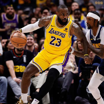 Apr 29, 2024; Denver, Colorado, USA; Los Angeles Lakers forward LeBron James (23) controls the ball as Denver Nuggets guard Kentavious Caldwell-Pope (5) guards in the third quarter during game five of the first round for the 2024 NBA playoffs at Ball Arena. Mandatory Credit: Isaiah J. Downing-USA TODAY Sports