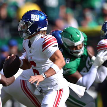 Oct 26, 2025; Philadelphia, Pennsylvania, USA; New York Giants quarterback Jaxson Dart (6) runs against the Philadelphia Eagles in the first quarter at Lincoln Financial Field.  