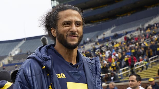 Apr 2, 2022; Ann Arbor, Michigan, USA;  Colin Kaepernick on the sideline before the Spring game at Michigan Stadium. Mandator