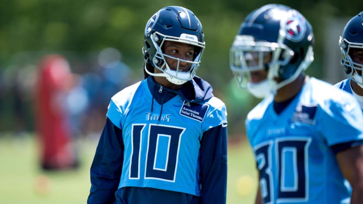 Wide receiver DeAndre Hopkins (10) and wide receiver Treylon Burks (16) communicate during Tennessee Titans practice at Ascension Saint Thomas Sports Park in Nashville, Tenn., Tuesday, May 21, 2024.