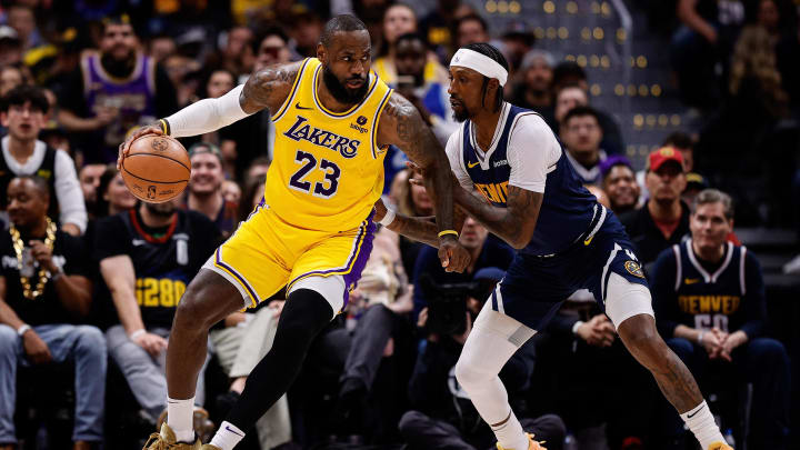 Apr 29, 2024; Denver, Colorado, USA; Los Angeles Lakers forward LeBron James (23) controls the ball as Denver Nuggets guard Kentavious Caldwell-Pope (5) guards in the third quarter during game five of the first round for the 2024 NBA playoffs at Ball Arena. Mandatory Credit: Isaiah J. Downing-USA TODAY Sports