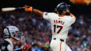 Aug 19, 2024; San Francisco, California, USA; San Francisco Giants outfielder Heliot Ramos (17) hits an RBI sac fly during the fifth inning against the Chicago White Sox at Oracle Park. Mandatory Credit: Sergio Estrada-Imagn Images