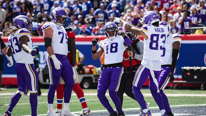 Sep 8, 2024; East Rutherford, New Jersey, USA; Minnesota Vikings wide receiver Justin Jefferson (18) celebrates after scoring a touchdown against the New York Giants during the first half at MetLife Stadium.