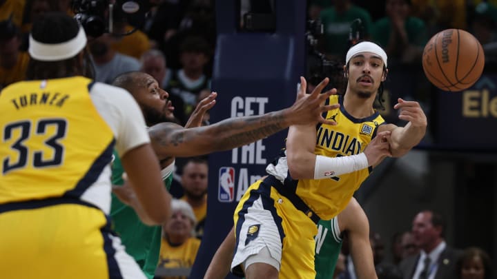 May 25, 2024; Indianapolis, Indiana, USA; Indiana Pacers guard Andrew Nembhard (2) passes the ball to center Myles Turner (33) against the Boston Celtics during the fourth quarter of game three of the eastern conference finals in the 2024 NBA playoffs at Gainbridge Fieldhouse. Mandatory Credit: Trevor Ruszkowski-USA TODAY Sports