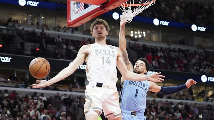 Nov 23, 2024; Chicago, Illinois, USA; Chicago Bulls forward Matas Buzelis (14) Memphis Grizzlies guard Scotty Pippen Jr. (1) go for the ball during the second half at United Center. Mandatory Credit: David Banks-Imagn Images