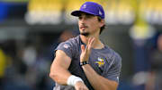 Oct 23, 2025; Inglewood, California, USA;  Minnesota Vikings quarterback Max Brosmer (12) warms up prior to the game against the Los Angeles Chargers at SoFi Stadium.