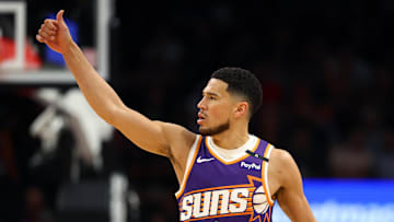 Mar 24, 2025; Phoenix, Arizona, USA; Phoenix Suns guard Devin Booker (1) reacts against the Milwaukee Bucks at Footprint Center. Mandatory Credit: Mark J. Rebilas-Imagn Images