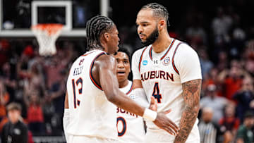 Auburn forward Johni Broome (4) celebrates a play against Michigan State with guard Miles Kelly (13), left, and guard Tahaad Pettiford (0), center, during the first half of the Elite Eight round of NCAA tournament at State Farm Arena in Atlanta, Ga. on Sunday, March 30, 2025.