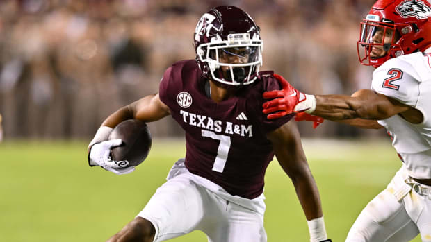 Texas A&M Aggies wide receiver Moose Muhammad catches a pass during a college football game in the SEC.