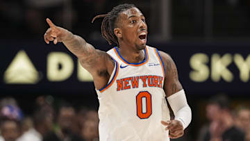 Apr 5, 2025; Atlanta, Georgia, USA; New York Knicks guard Delon Wright (0) reacts after making a three point shot against the Atlanta Hawks during the second half at State Farm Arena. Mandatory Credit: Dale Zanine-Imagn Images