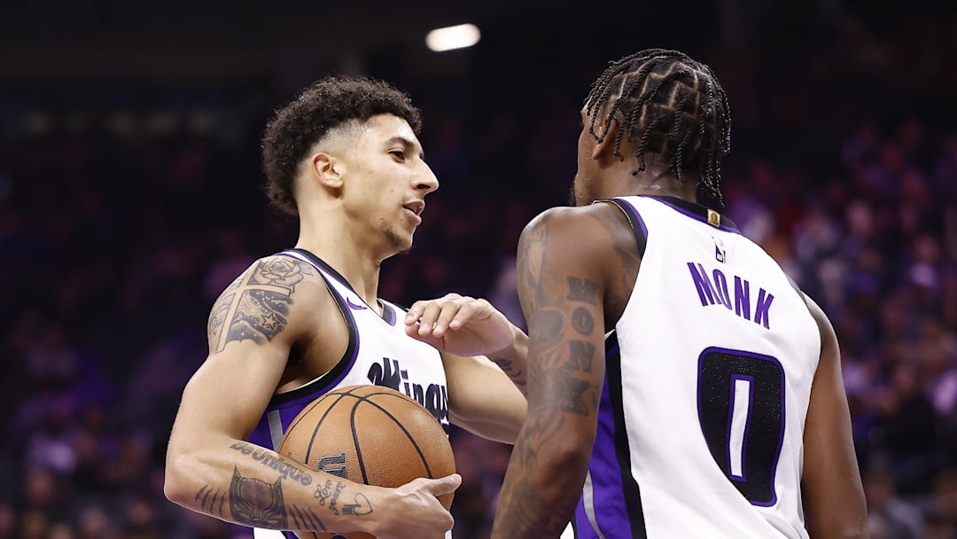 Nov 30, 2025; Sacramento, California, USA; Sacramento Kings guard Nique Clifford (5) and guard Malik Monk (0) at the end of the first quarter against the Memphis Grizzlies at Golden 1 Center. Nov 30, 2025; Sacramento, California, USA; Sacramento Kings guard Nique Clifford (5) and guard Malik Monk (0) at the end of the first quarter against the Memphis Grizzlies at Golden 1 Center.