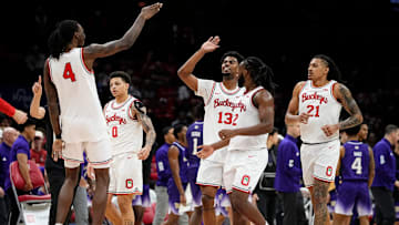 Ohio State Buckeyes forward Aaron Bradshaw (4) celebrates a block by forward Sean Stewart (13) during the second half of the NCAA men's basketball game against the Washington Huskies at Value City Arena in Columbus on Feb. 12, 2025. Ohio State won 93-69.