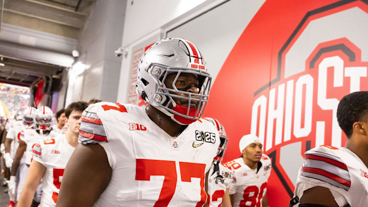 Jan 20, 2025; Atlanta, GA, USA; Ohio State Buckeyes offensive lineman Tegra Tshabola (77) against the Notre Dame Fighting Irish during the CFP National Championship college football game at Mercedes-Benz Stadium. Mandatory Credit: Mark J. Rebilas-Imagn Images
