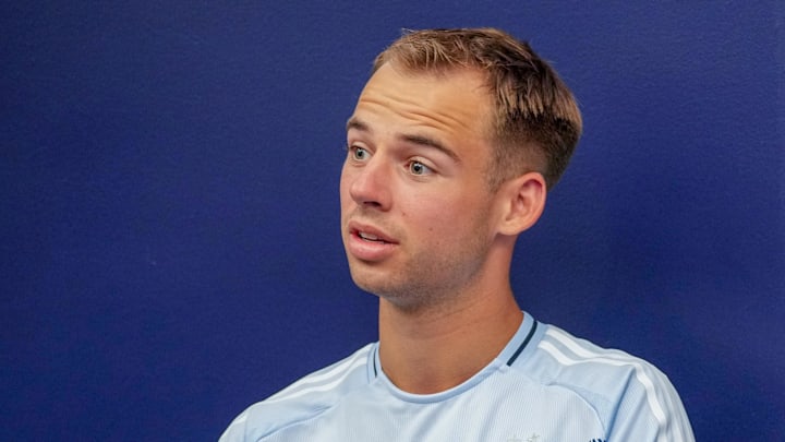 Feb 14, 2025; Kansas City, Kansas, USA; Sporting Kansas City defender Jansen Miller (15) speaks to media during the Sporting Kansas City Media Day at Children's Mercy Park. Mandatory Credit: Denny Medley-Imagn Images