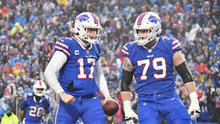 Dec 11, 2022; Orchard Park, New York, USA; Buffalo Bills quarterback Josh Allen (17) celebrates scoring a touchdown  with offensive tackle Spencer Brown (79) in the third quarter at Highmark Stadium. Mandatory Credit: Mark Konezny-Imagn Images