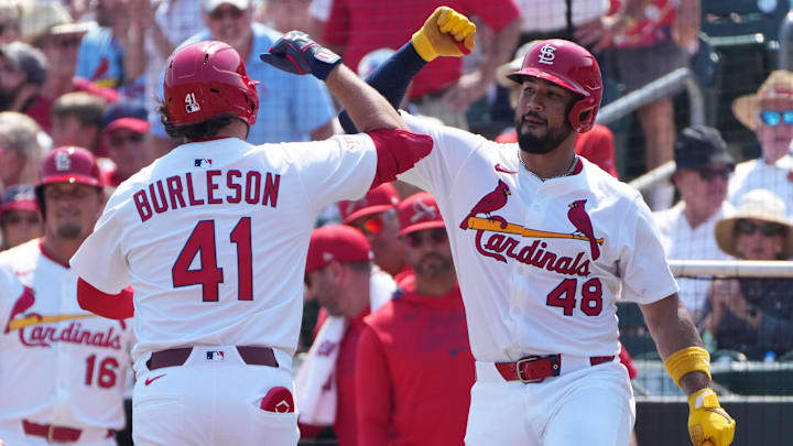 Mar 9, 2025; Jupiter, Florida, USA;  St. Louis Cardinals designated hitter Alec Burleson (41) in congratulated by catcher Iván Herrera (48) after hitting a solo home run in the second inning against the New York Yankees at Roger Dean Chevrolet Stadium. Mandatory Credit: Jim Rassol-Imagn Images