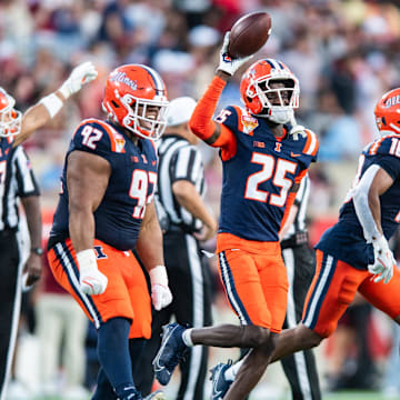 Dec 31, 2024; Orlando, FL, USA; Illinois Fighting Illini defensive back Jaheim Clarke (25) celebrates his fumble recovery against the South Carolina Gamecocks in the third quarter at Camping World Stadium. Mandatory Credit: Jeremy Reper-Imagn Images