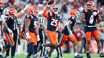 Dec 31, 2024; Orlando, FL, USA; Illinois Fighting Illini defensive back Jaheim Clarke (25) celebrates his fumble recovery against the South Carolina Gamecocks in the third quarter at Camping World Stadium. Mandatory Credit: Jeremy Reper-Imagn Images