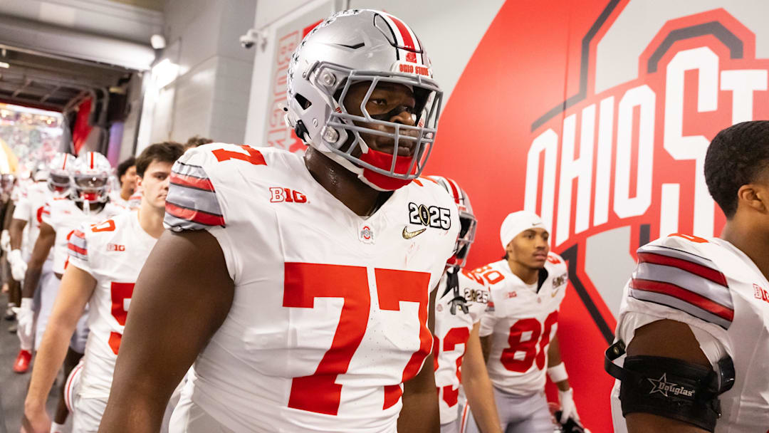 Jan 20, 2025; Atlanta, GA, USA; Ohio State Buckeyes offensive lineman Tegra Tshabola (77) against the Notre Dame Fighting Irish during the CFP National Championship college football game at Mercedes-Benz Stadium. Mandatory Credit: Mark J. Rebilas-Imagn Images