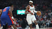 Mar 9, 2025; Portland, Oregon, USA;  Portland Trail Blazers forward Jerami Grant (9) brings the ball up the court against Detroit Pistons center Jalen Duren (0) in the first half at Moda Center. Mandatory Credit: Jaime Valdez-Imagn Images