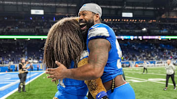 Detroit Lions defensive end Za'Darius Smith (99) hugs mascot Roary to celebrate 52-6 win over Jacksonville Jaguars.