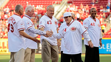 Reds great Pete Rose shakes hands with his fellow team mates of the 1976 Big Red Machine Reds team as they are introduced before the MLB National League game between the Cincinnati Reds and the San Diego Padres at Great American Ball Park in downtown Cincinnati on Friday, June 24, 2016.