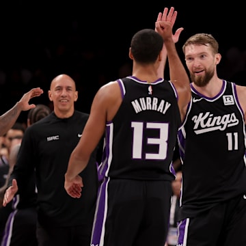 Jan 27, 2025; Brooklyn, New York, USA; Sacramento Kings forward Domantas Sabonis (11) celebrates his three point shot against the Brooklyn Nets with forward Keegan Murray (13) during the fourth quarter at Barclays Center. Mandatory Credit: Brad Penner-Imagn Images