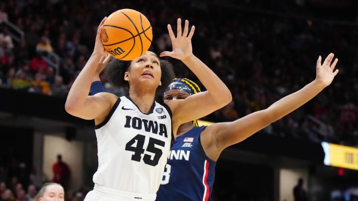 Apr 5, 2024; Cleveland, OH, USA; Iowa Hawkeyes forward Hannah Stuelke (45) shoots against Connecticut Huskies forward Aaliyah Edwards (3) in the first quarter in the semifinals of the Final Four of the womens 2024 NCAA Tournament at Rocket Mortgage FieldHouse. Mandatory Credit: Kirby Lee-USA TODAY Sports