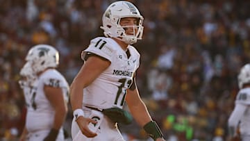 Nov 1, 2025; Minneapolis, Minnesota, USA; Michigan State Spartans quarterback Alessio Milivojevic (11) celebrates a touchdown against the Minnesota Golden Gophers during the second half at Huntington Bank Stadium. Mandatory Credit: Matt Krohn-Imagn Images