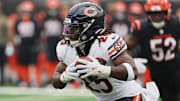 Nov 2, 2025; Cincinnati, Ohio, USA; Chicago Bears running back Kyle Monangai (25) runs with the ball against Cincinnati Bengals defensive end Cedric Johnson (52) during the first quarter at Paycor Stadium. Mandatory Credit: Joseph Maiorana-Imagn Images
