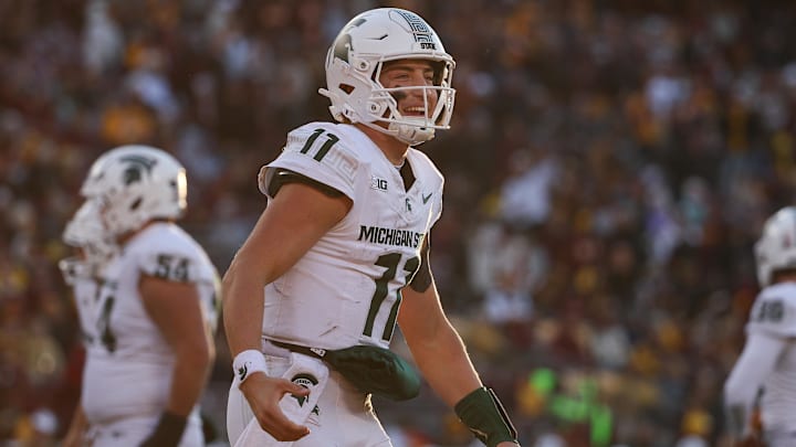 Nov 1, 2025; Minneapolis, Minnesota, USA; Michigan State Spartans quarterback Alessio Milivojevic (11) celebrates a touchdown against the Minnesota Golden Gophers during the second half at Huntington Bank Stadium. Mandatory Credit: Matt Krohn-Imagn Images