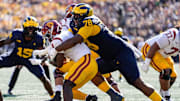 Michigan defensive lineman Kenneth Grant (78) tackles USC running back Woody Marks (4) during the first half at Michigan Stadium in Ann Arbor on Saturday, Sept. 21, 2024.