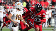 Sep 21, 2024; Lubbock, Texas, USA;  Texas Tech Red Raiders defensive back Miquel Dingle Jr. (35) pressures Arizona State Sun Devils quarterback Sam Leavitt (10) in the second half at Jones AT&T Stadium and Cody Campbell Field. Mandatory Credit: Michael C. Johnson-Imagn Images
