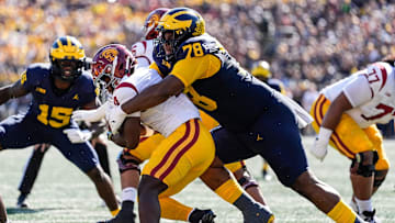 Michigan defensive lineman Kenneth Grant (78) tackles USC running back Woody Marks (4) during the first half at Michigan Stadium in Ann Arbor on Saturday, Sept. 21, 2024.