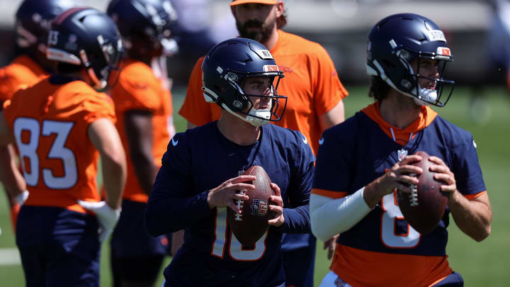 May 23, 2024; Englewood, CO, USA; Denver Broncos quarterback Bo Nix (10) and quarterback Jarrett Stidham (8) during organized team activities at Centura Health Training Center.