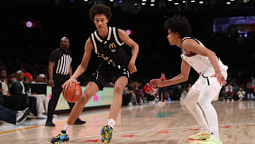 Apr 1, 2025; Brooklyn, NY, USA; McDonald's All American East forward Nate Ament (10) dribbles the ball against McDonald's All American West guard Mikel Brown Jr. (11) during the second half of the game at Barclays Center. Mandatory Credit: Pamela Smith-Imagn Images