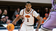 Jan 7, 2025; Stillwater, Oklahoma, USA; Oklahoma State Cowboys guard Bryce Thompson (1) brings the ball up court during the first half against the Kansas State Wildcats at Gallagher-Iba Arena. Mandatory Credit: William Purnell-Imagn Images
