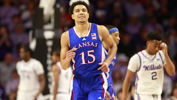 Kansas graduate senior guard Kevin McCullar Jr. (15) jogs back after scoring against Kansas State 