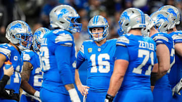 Detroit Lions quarterback Jared Goff (16), center, talks to teammates before a play against Green Bay Packers during the first half at Ford Field in Detroit on Thursday, Dec. 5, 2024.