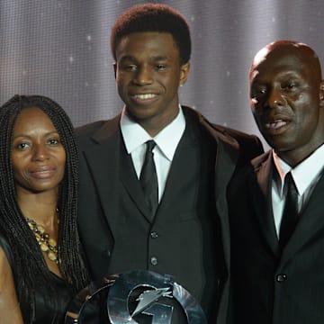 Andrew Wiggins with his mother Marita Payne and father Mitchell Wigginis after receiving the 2013 Gatorade National Boys Athlete of the Year Award.