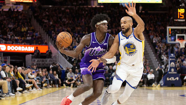 April 14, 2024; San Francisco, California, United States; Golden State Warriors guard Jerome Robinson (18) guards Utah Jazz forward Taylo