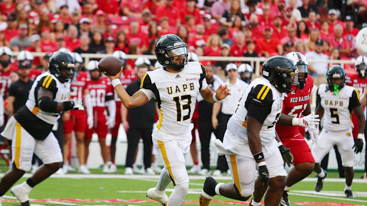 Aug 30, 2025; Lubbock, Texas, USA; (Editors Notes: Caption Correction)  Arkansas-Pine Bluff Golden Lions quarterback Christian Peters (13) passes against the Texas Tech Red Raiders in the first half at Jones AT&T Stadium. Mandatory Credit: Michael C. Johnson-Imagn Images