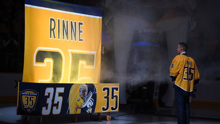 Feb 24, 2022; Nashville, Tennessee, USA; Former Nashville Predators goaltender Pekka Rinne (35) watches as his number 35 is raised to the rafters in a jersey retirement ceremony before the Nashville Predators game against the Dallas Stars at Bridgestone Arena. Mandatory Credit: Christopher Hanewinckel-USA TODAY Sports Feb 24, 2022; Nashville, Tennessee, USA; Former Nashville Predators goaltender Pekka Rinne (35) watches as his number 35 is raised to the rafters in a jersey retirement ceremony before the Nashville Predators game against the Dallas Stars at Bridgestone Arena. Mandatory Credit: Christopher Hanewinckel-USA TODAY Sports