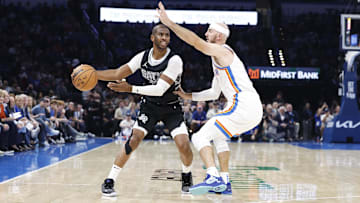 Oct 30, 2024; Oklahoma City, Oklahoma, USA; Oklahoma City Thunder guard Alex Caruso (9) defends San Antonio Spurs guard Chris Paul (3) during the second quarter at Paycom Center. Mandatory Credit: Alonzo Adams-Imagn Images