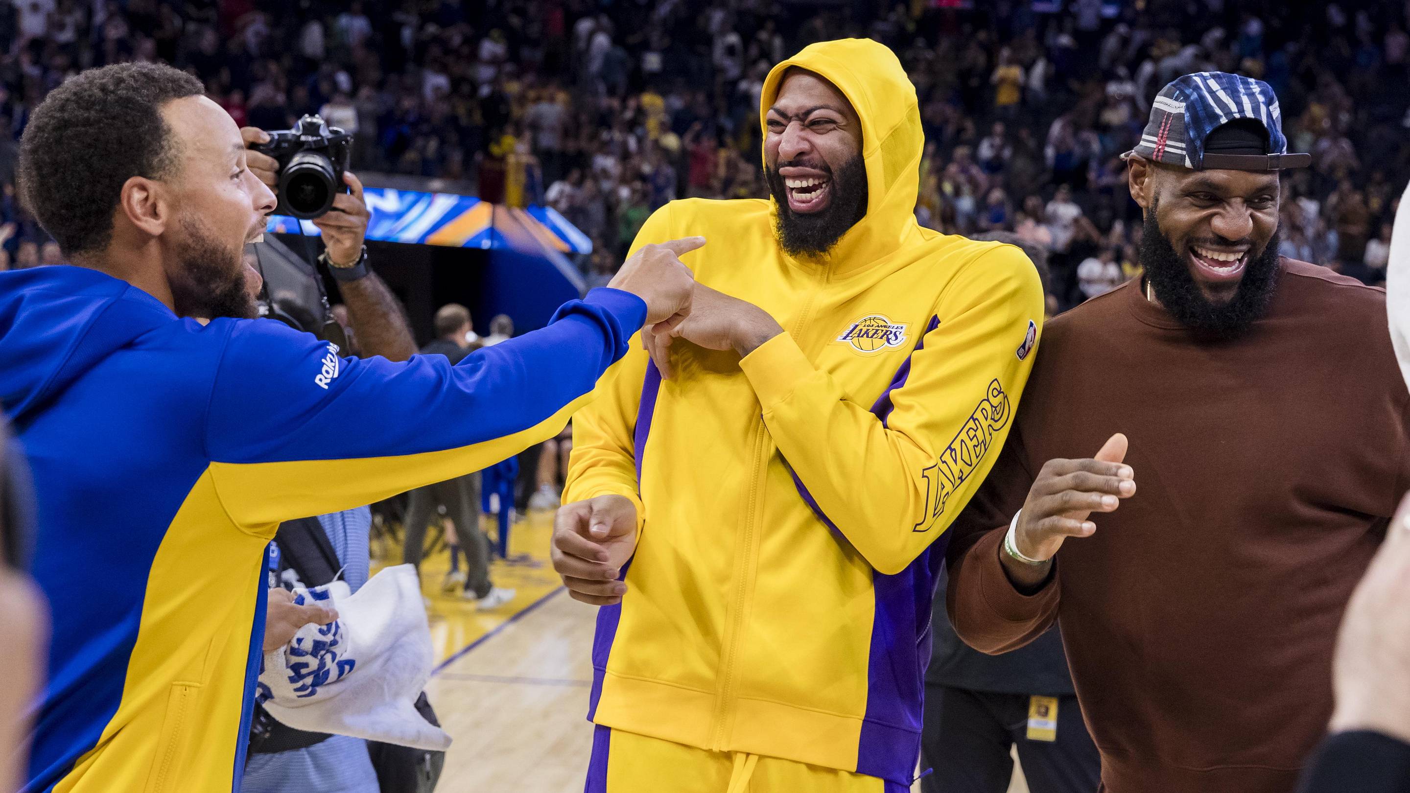 Oct 7, 2023; San Francisco, California, USA; Golden State Warriors guard Stephen Curry (30) and Los Angeles Lakers center Anthony Davis (3) and forward LeBron James (23) laugh after a game at Chase Center. Mandatory Credit: John Hefti-Imagn Images