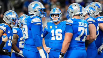 Detroit Lions quarterback Jared Goff (16), center, talks to teammates before a play against Green Bay Packers during the first half at Ford Field in Detroit on Thursday, Dec. 5, 2024.