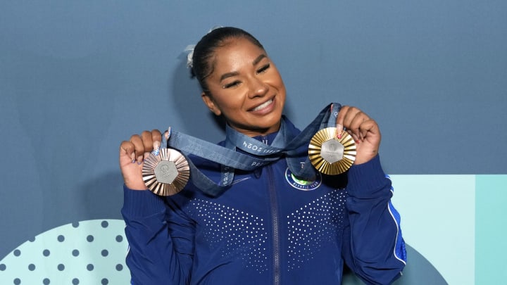 Aug 5, 2024; Paris, France; Jordan Chiles of the United States poses for a photo with her gold and bronze medasl after day three of the gymnastics event finals during the Paris 2024 Olympic Summer Games.