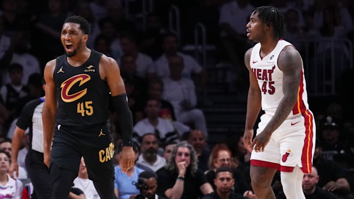 Donovan Mitchell #45 of the Cleveland Cavaliers reacts against Davion Mitchell #45 of the Miami Heat in the 2025 playoffs.