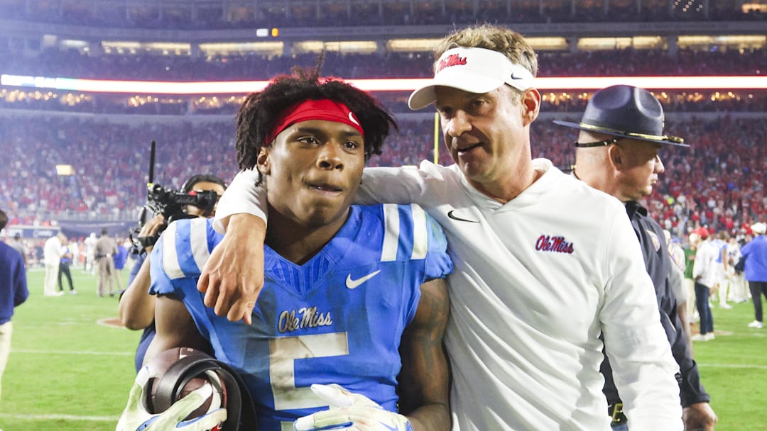 Nov 15, 2025; Oxford, Mississippi, USA; Mississippi Rebels head coach Lane Kiffin embraces running back Kewan Lacy (5) after defeating the Florida Gators at Vaught-Hemingway Stadium. Mandatory Credit: Petre Thomas-Imagn Images Nov 15, 2025; Oxford, Mississippi, USA; Mississippi Rebels head coach Lane Kiffin embraces running back Kewan Lacy (5) after defeating the Florida Gators at Vaught-Hemingway Stadium. Mandatory Credit: Petre Thomas-Imagn Images
