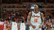 Feb 24, 2024; Stillwater, Oklahoma, USA; Oklahoma State Cowboys guard Javon Small (12) reacts after a play during the first half against the Oklahoma Sooners at Gallagher-Iba Arena. Mandatory Credit: William Purnell-Imagn Images